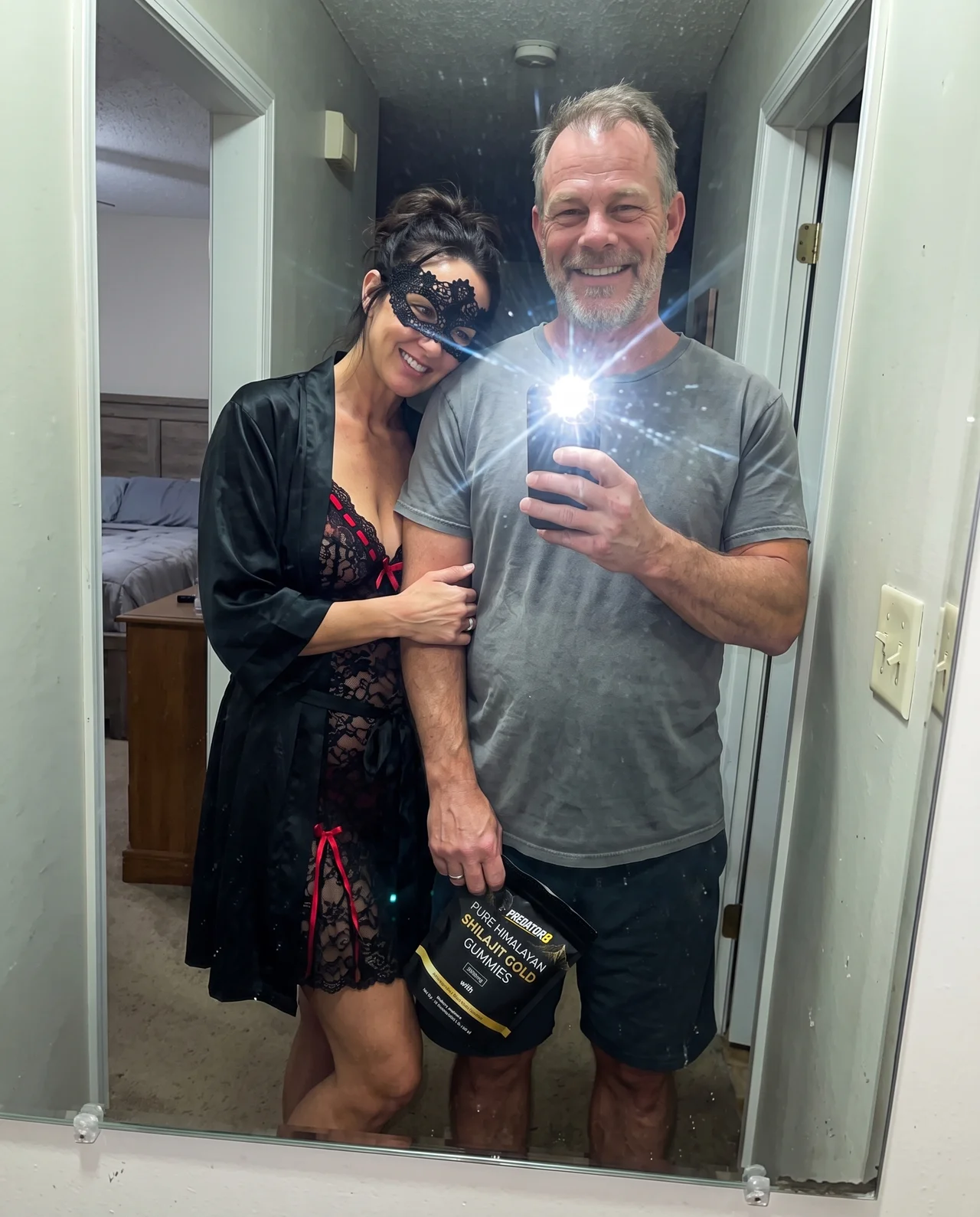 Couple posing with their PREDATOR8 pouch
