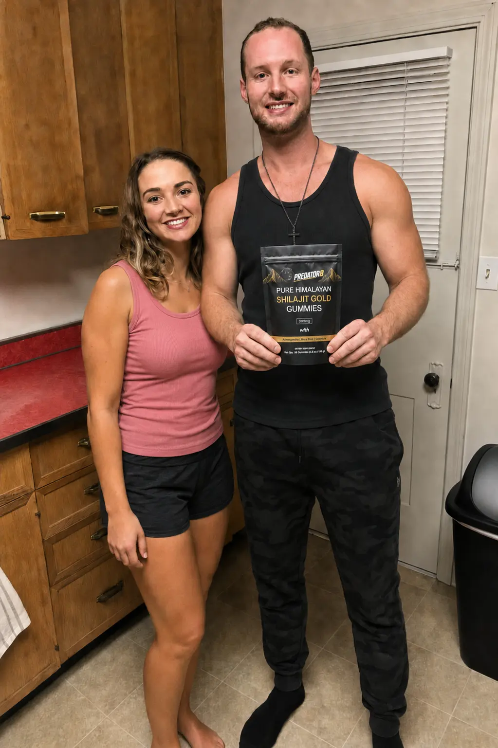 Couple in the kitchen holding a PREDATOR8 pouch