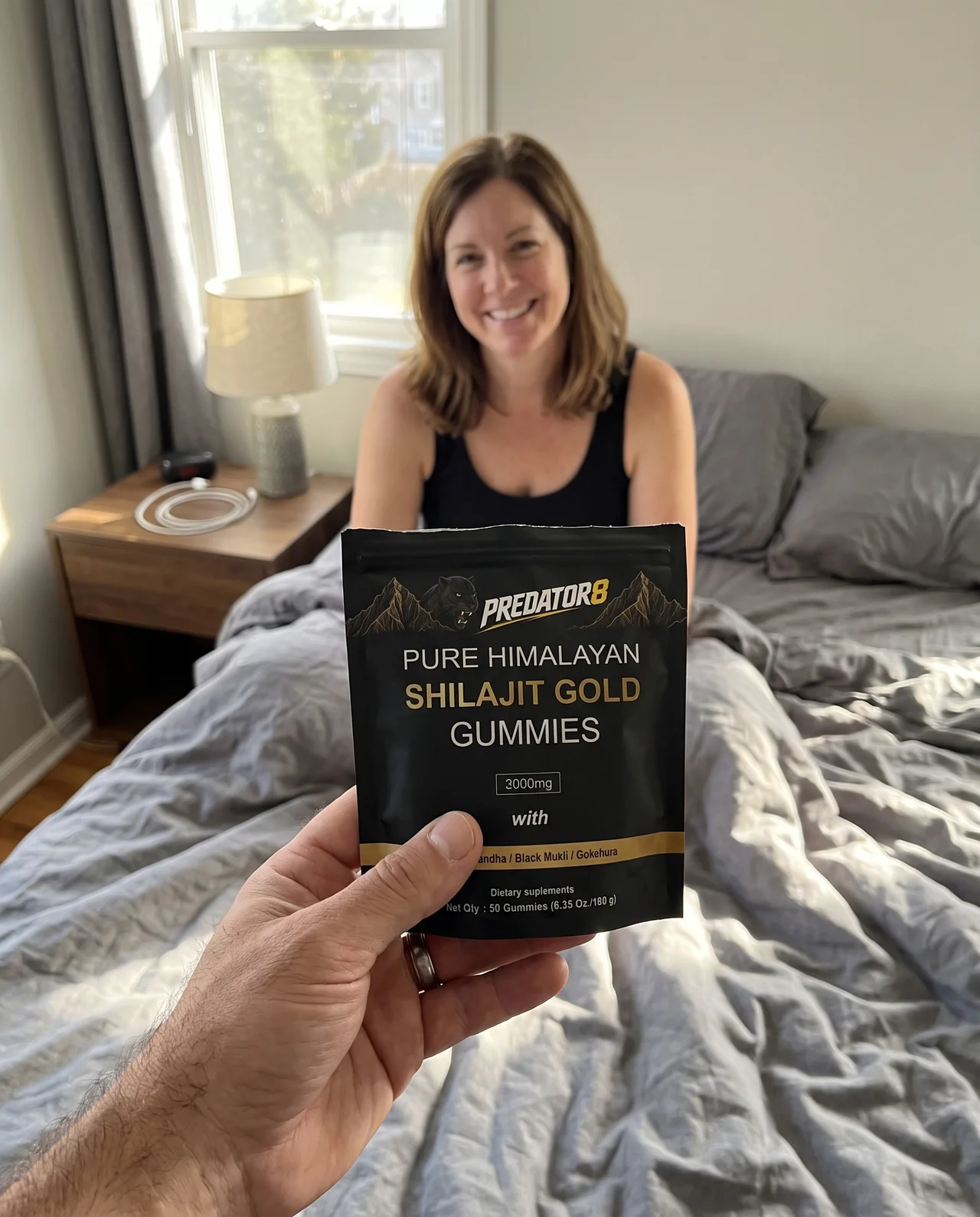A PREDATOR8 Shilajit Gold pouch held up in a kitchen