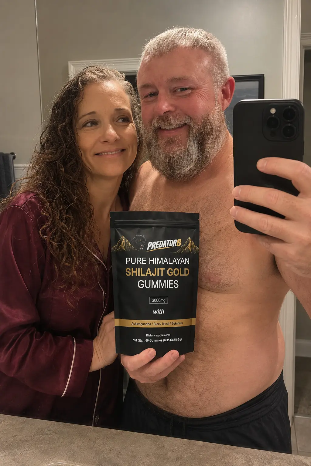 Couple taking a bathroom mirror selfie with a PREDATOR8 pouch