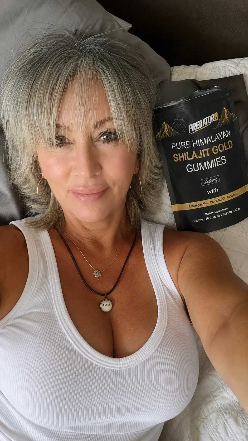 Woman on the bed with a PREDATOR8 Shilajit Gold pouch