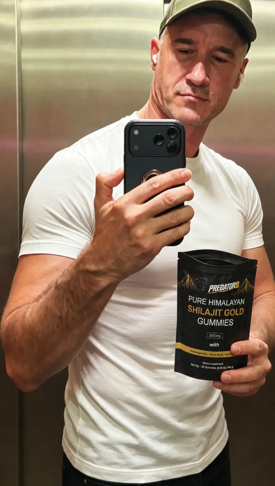 Man taking a mirror selfie in a lift with a PREDATOR8 pouch
